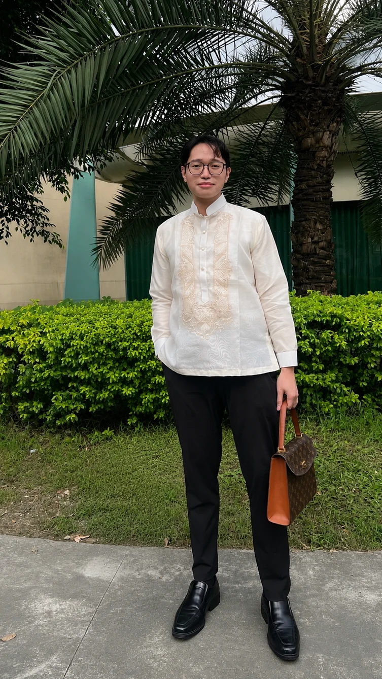 Isaac A. Delos Reyes outdoors in a white formal shirt